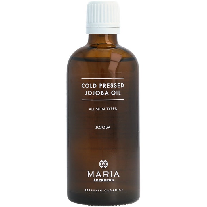 Maria Åkerberg Cold Pressed Jojoba Oil fugtgivende ansigtsolie i en brun glasflaske med hvidt skruelåg