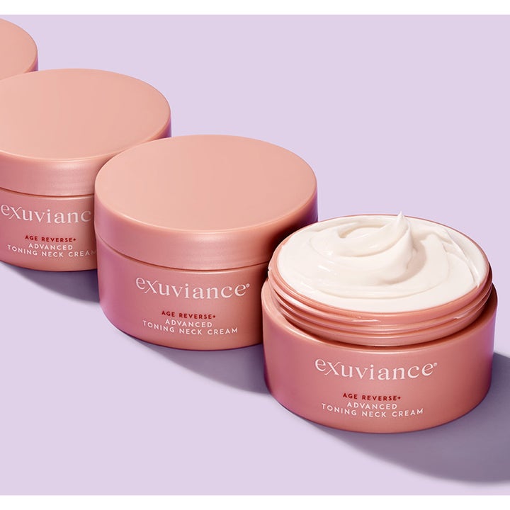 Exuviance Age Reverse Toning Neck Cream 125 g opstrammende halscreme i lyserøde krukker med hvid cremet tekstur.