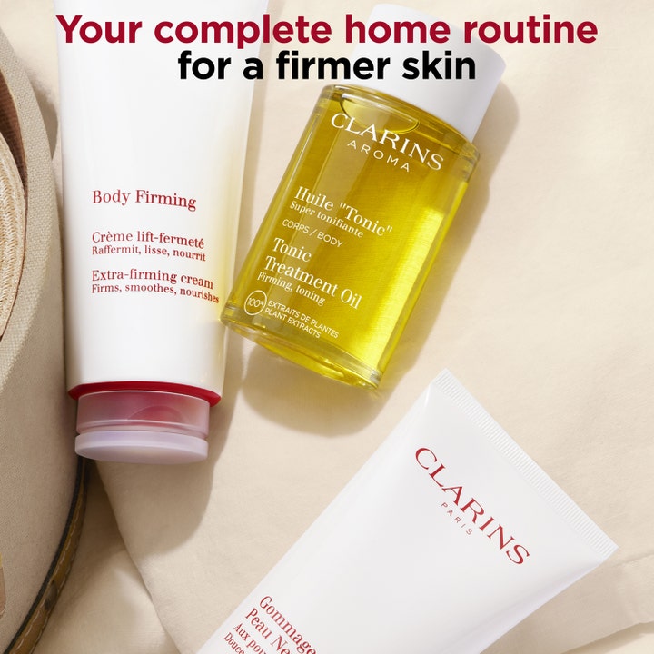 Clarins Body Firming Extra-Firming Cream 200 ml opstrammende kropscreme i en hudplejerutine med gul kropsolie