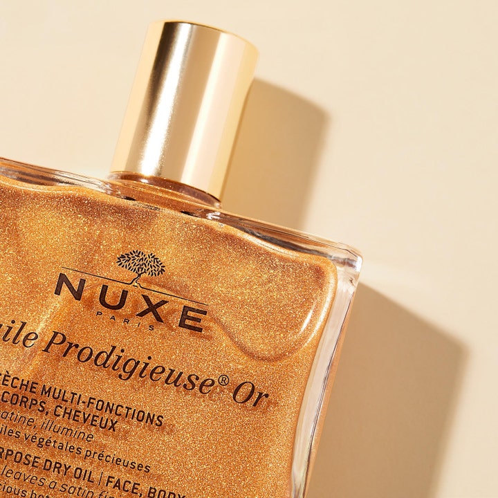 Nuxe Huile Prodigieuse OR 100 ml tørolie med guldglimmer giver huden strålende glød i flakon med guldlåg