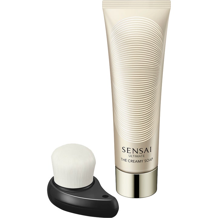 Sensai Ultimate The Creamy Soap 125 ml luksuriøs ansigtsrens i elegant guldfarvet tube med en blød hvid rensebørste