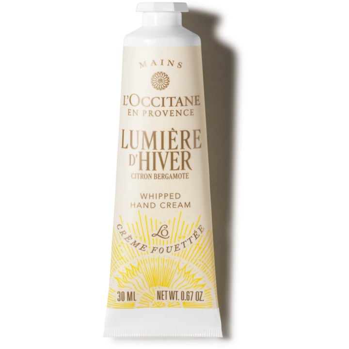 L'Occitane Lumière d'Hiver 30 ml blødgørende håndcreme i hvid tube med gult solmønster og hvidt låg
