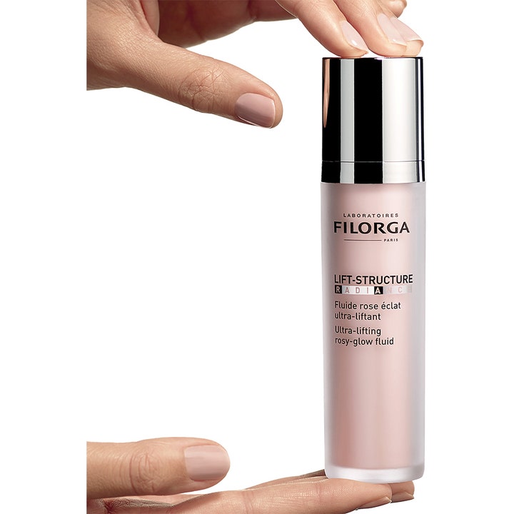 Filorga Lift-Structure Radiance 50 ml opstrammende dagcreme giver glød i frostet pumpeflaske med sølvlåg.