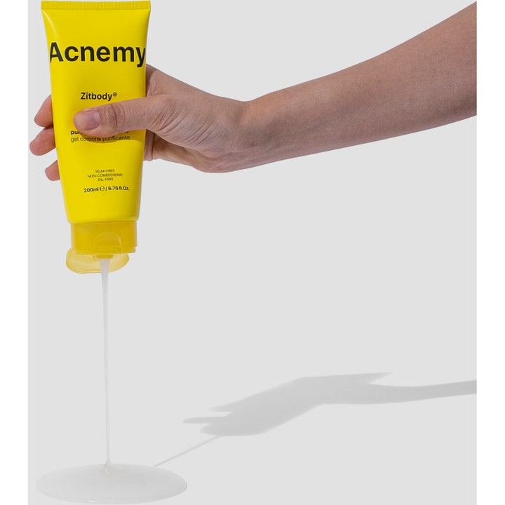 Niche Beauty Lab Acnemy Zitbody 200 ml rensende bodywash i gul tube med klar gel der løber ud