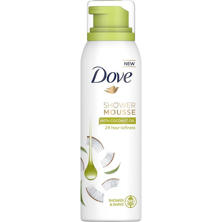 Dove Shower Mousse med kokosolie til bad og barbering i hvid sprayflaske med lysegrønt pumpehoved og kokosstykker
