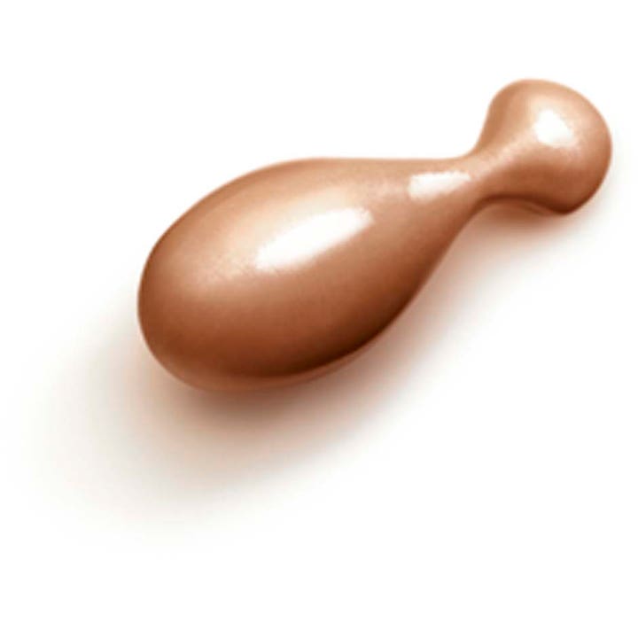 Clarins Milky Boost Capsules 06 7,8 ml glødgivende ansigtsserum vist som en glinsende bronzefarvet kapsel