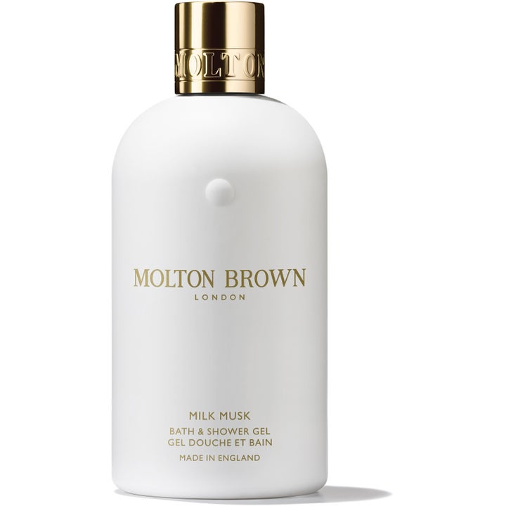 Molton Brown Milk Musk Bath & Shower Gel 300 ml kropspleje i en stilren hvid flaske med luksuriøst guldlåg.