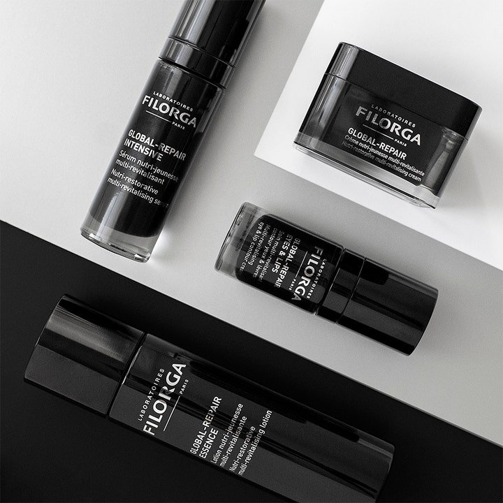 Filorga Global-Repair Intensive Serum 30 ml genopbyggende serum i sort flakon vist med andre produkter i serien