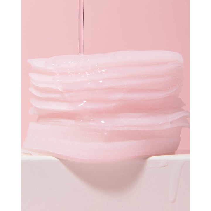 Banila Co Clean It Zero Pink Hydration Toner Pad 70 stk fugtgivende toner pads i en våd stabel på lyserød baggrund