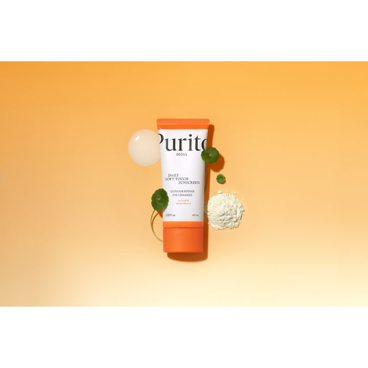 Purito Daily Soft Touch Sunscreen 60 ml beskyttende solcreme med ceramider i orange tube med blade og pulver