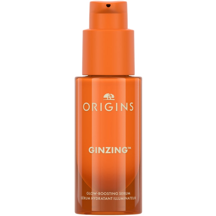 Origins GinZing Glow-Boosting Serum giver huden glød i en gennemsigtig orange flaske med mat pumpe.