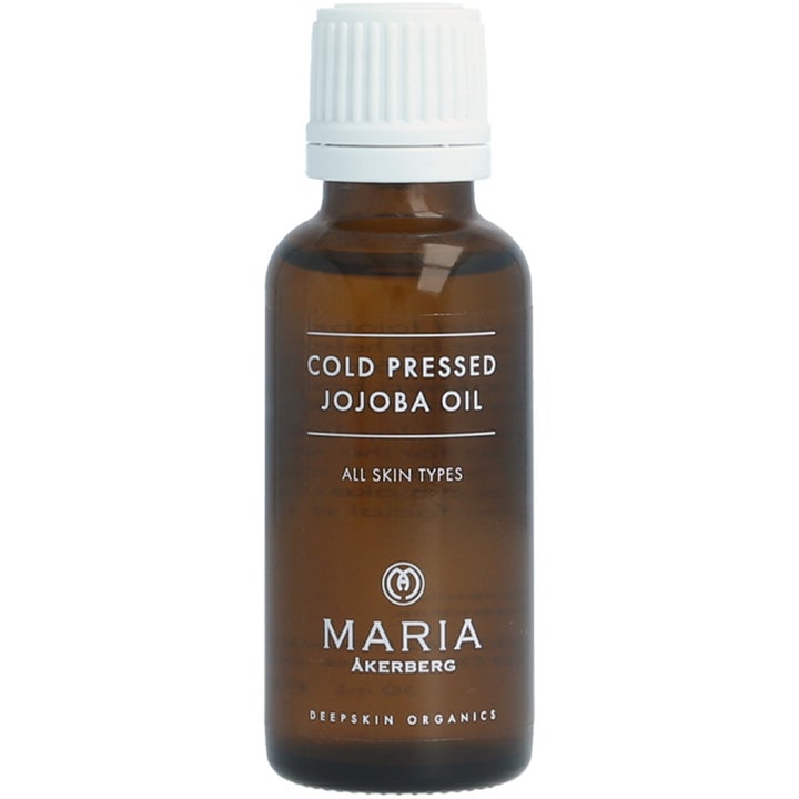 Maria Åkerberg Cold Pressed Jojoba Oil blødgørende ansigtsolie i en lille brun glasflaske med hvidt skruelåg