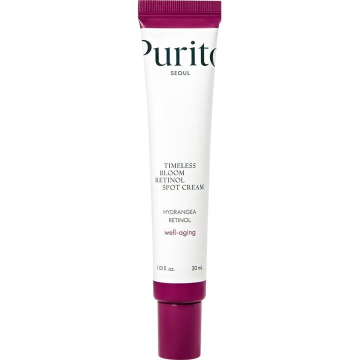 Purito Timeless Bloom Retinol Spot Cream 30 ml mod rynker i hvid tube med lilla detaljer og skruelåg.
