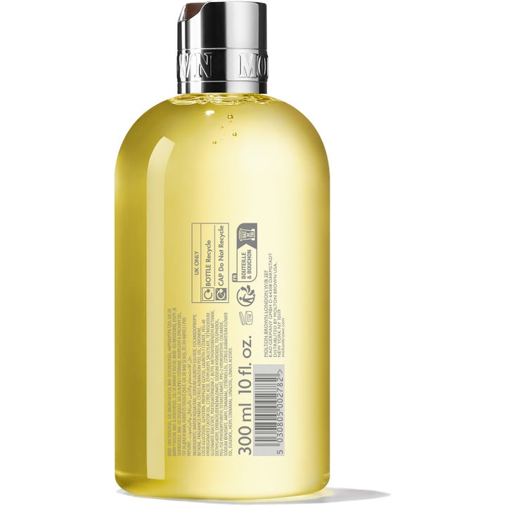 Molton Brown Orange & Bergamot Bath & Shower Gel 300 ml opfriskende showergel i klar flaske med gul gel og sølvlåg set bagfra.