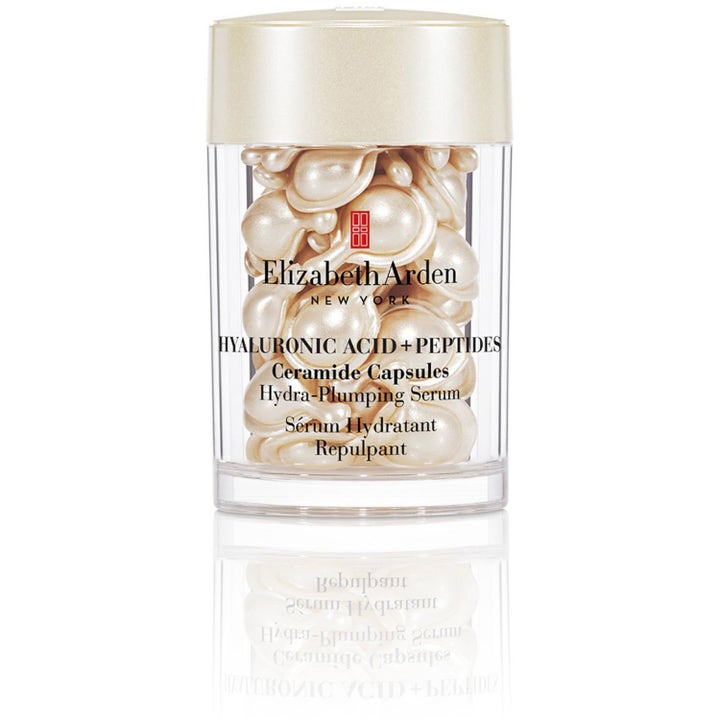 Elizabeth Arden Hyaluronic Acid + Peptides Ceramide Capsules Hydra-Plumping Serum i gennemsigtig krukke med perlemorshvide kapsler.