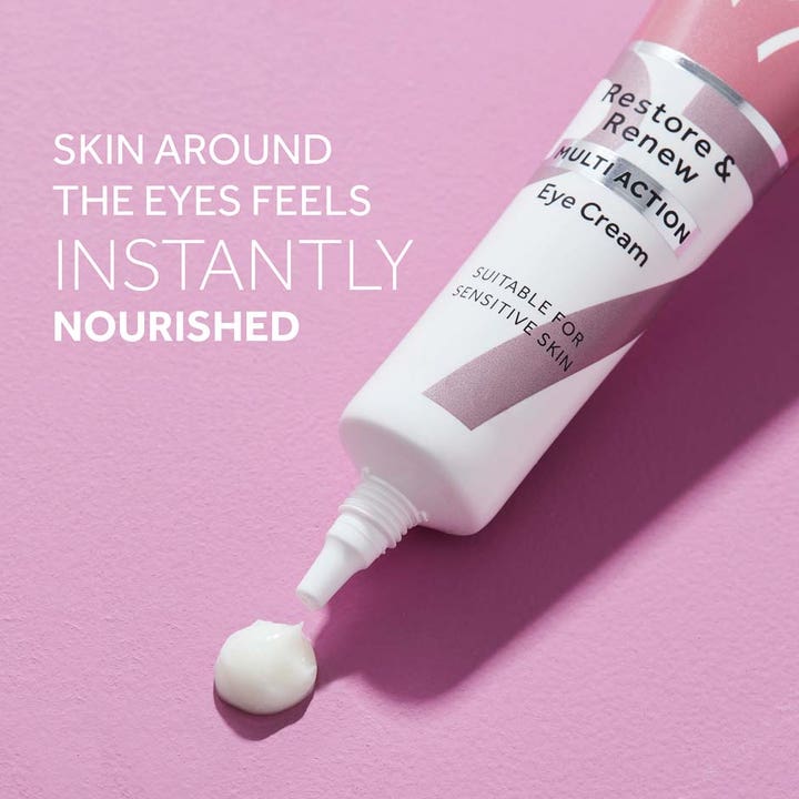 No7 Restore & Renew Multi Action Eye Cream 15 ml nærende øjencreme i hvid tube med cremet tekstur på lilla baggrund