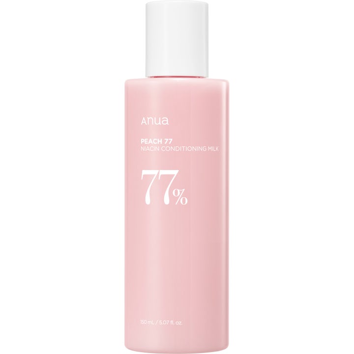 Anua Peach 77 Niacin Conditioning Milk 150 ml blødgørende ansigtslotion i lyserød flaske med hvidt låg.