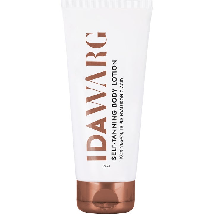 Ida Warg Self-Tanning Body Lotion 200 ml fugtgivende selvbruner i hvid tube med bronzefarvet tekst og låg