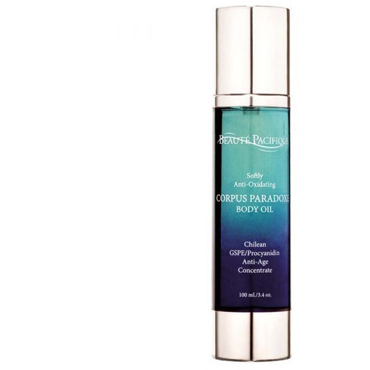 Beauté Pacifique Corpus Paradoxe Body Oil 100 ml anti-age kropsolie i en blå flaske med sølvfarvet låg og bund.