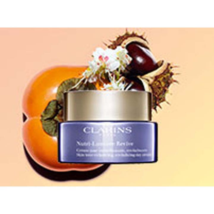 Clarins Nutri-Lumière Revive 50 ml revitaliserende dagcreme i lilla glaskrukke med guld låg og kastanje
