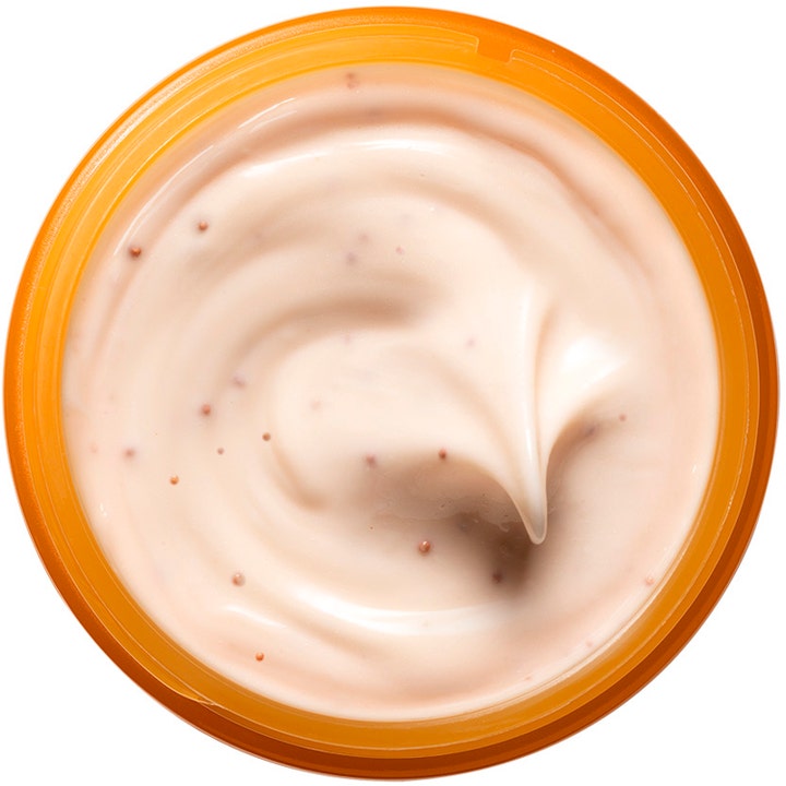 Origins GinZing Glow-Boosting Mask 75 ml ansigtsmaske med cremet ferskenfarvet tekstur og små korn i orange krukke