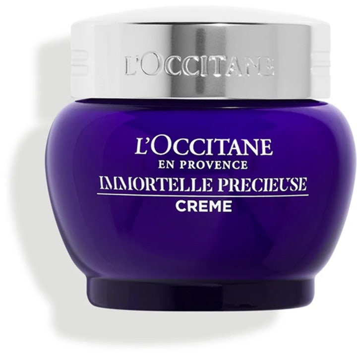 L'Occitane Immortelle Precieuse Creme fugtgivende ansigtscreme i mørkeblå glaskrukke med elegant sølvlåg