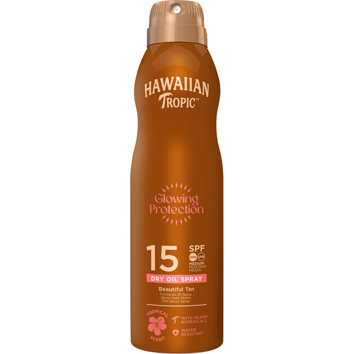 Hawaiian Tropic Glowing Protection SPF 15 sololie i brun sprayflaske der giver huden en smuk, gylden glød