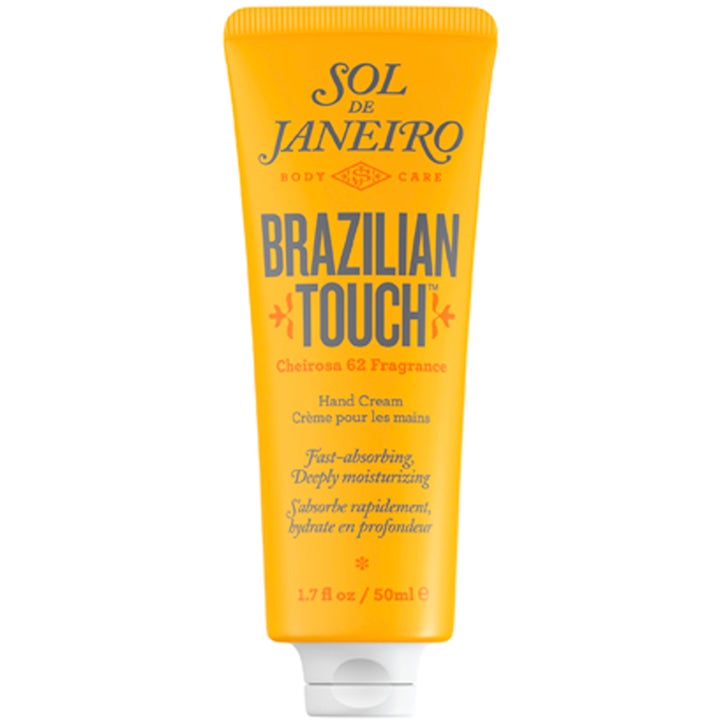 Sol de Janeiro Brazilian Touch 50ml fugtgivende håndcreme i en klar gul tube med hvidt låg og blå tekst.