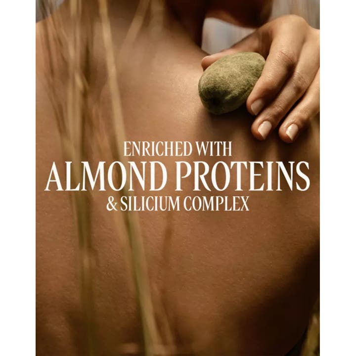 L'Occitane Almond Milk Concentrate 200 ml kropscreme på hud med mandel og tekst om silicium complex