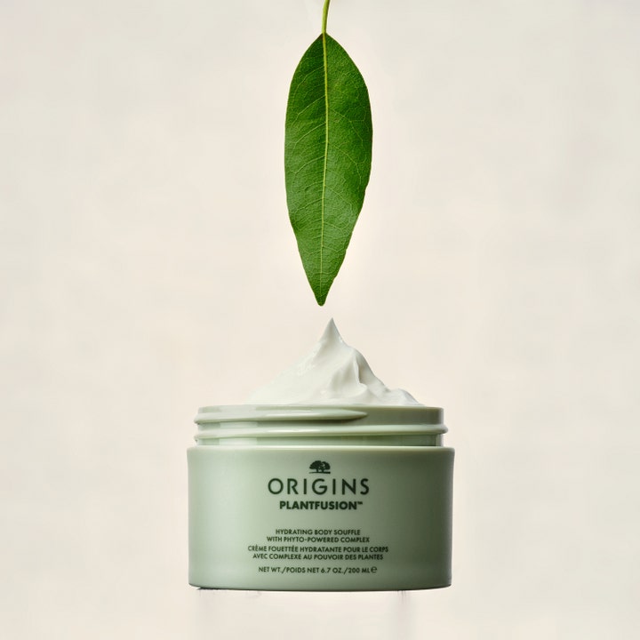 Origins Plantfusion Hydrating Body Souffle 200 ml fugtgivende bodycreme i grøn krukke med hvid tekstur og et blad