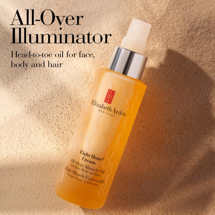 Elizabeth Arden Eight Hour All-Over Miracle Oil 100 ml kropsolie i sprayflaske på sand med teksten All-Over Illuminator