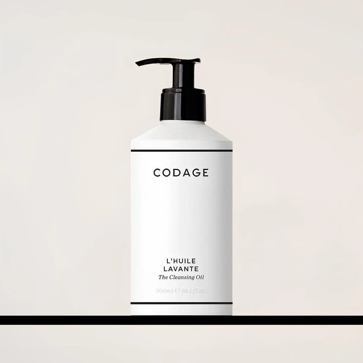 Codage Paris The Cleansing Oil 300 ml plejende badeolie i hvid flon med sort pumpe der renser huden