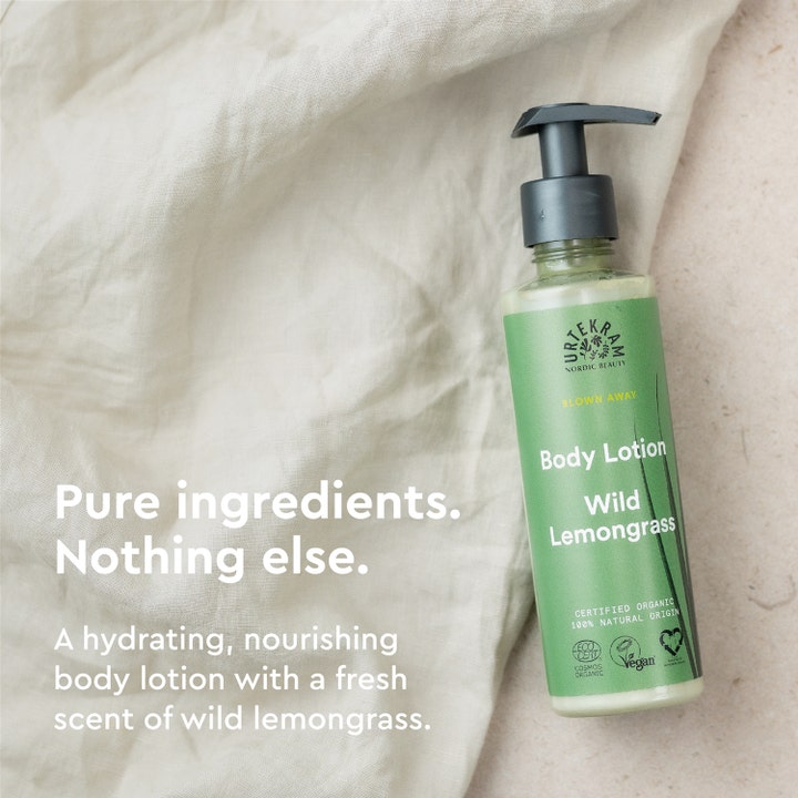 Urtekram Wild Lemongrass 245 ml fugtgivende bodylotion i grøn pumpeflaske på hørstof med teksten Pure ingredients.