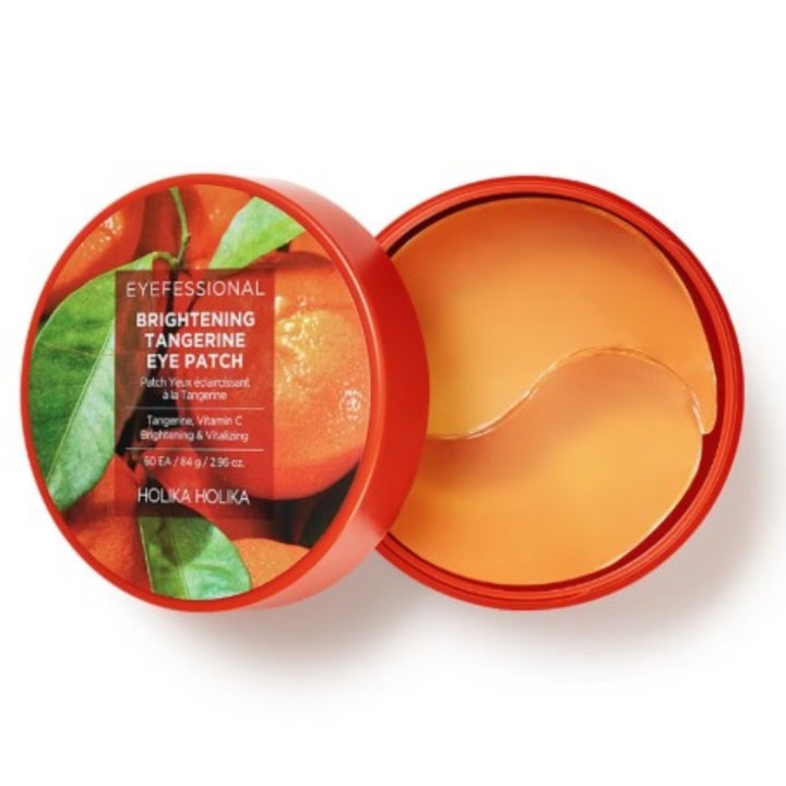 Holika Holika Brightening Tangerine Eye Patch 60 styk lysner med C-vitamin og har orange gel-patches i en rød krukke.