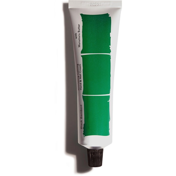 Black Bamboo Nourishing Calming Hand & Nail Cream nærende håndcreme i hvid tube med grøn grafik og sort låg.