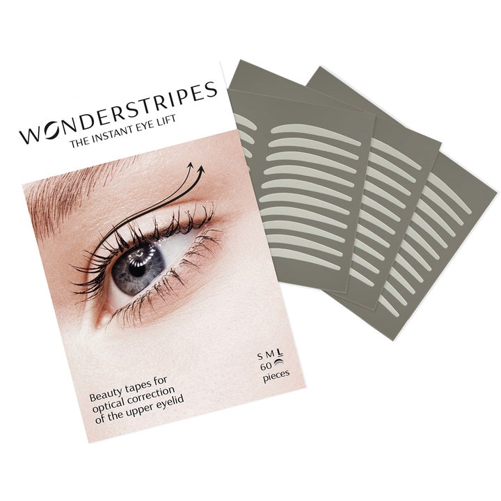 Wonderstripes The Instant Eye Lift 60 stk øjenlågstape skaber et løft vist med hvid emballage og grå ark