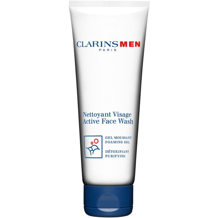 ClarinsMen Active Face Wash rensende skummende gel i hvid tube med blåt låg der fjerner urenheder effektivt.