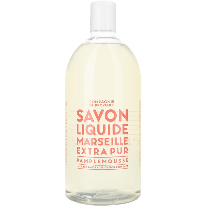 Compagnie de Provence Savon Liquide Pamplemousse flydende sæbe i en klar plastflaske med hvidt skruelåg.