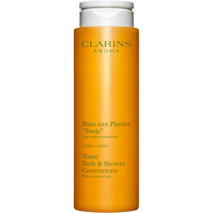 Clarins Tonic Bath & Shower Concentrate 200ml opstrammende kropsvask i en høj orange flaske med hvidt låg