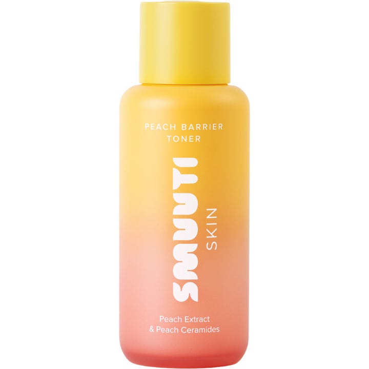 Smuuti Skin Peach Barrier Toner fugtgivende ansigtstoner i en gul og ferskenfarvet gradientflaske med gult låg.