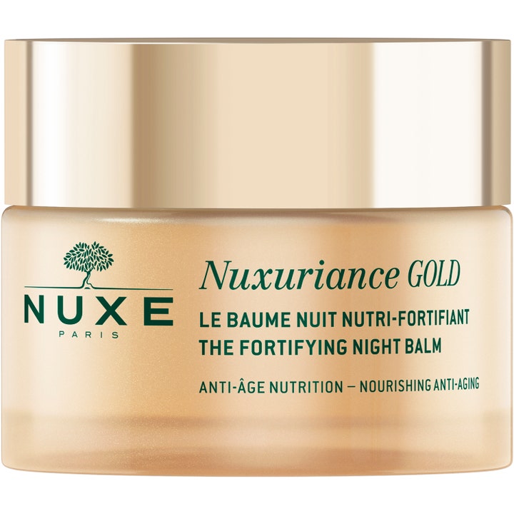 Nuxe Nuxuriance Gold Night Balm nærende anti-age natcreme i en elegant frostet guldkrukke med metallisk guldlåg.