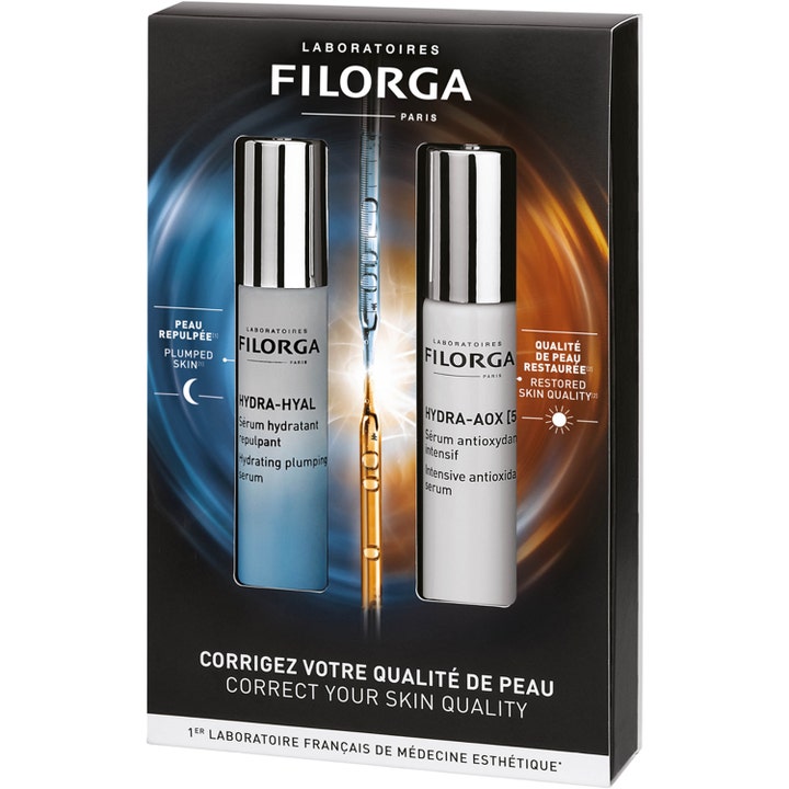 Filorga Hydra-Hyal og Hydra-AOX [5] gavesæt med fugtgivende serum i blå og hvide flasker med sølvlåg i en sort æske.
