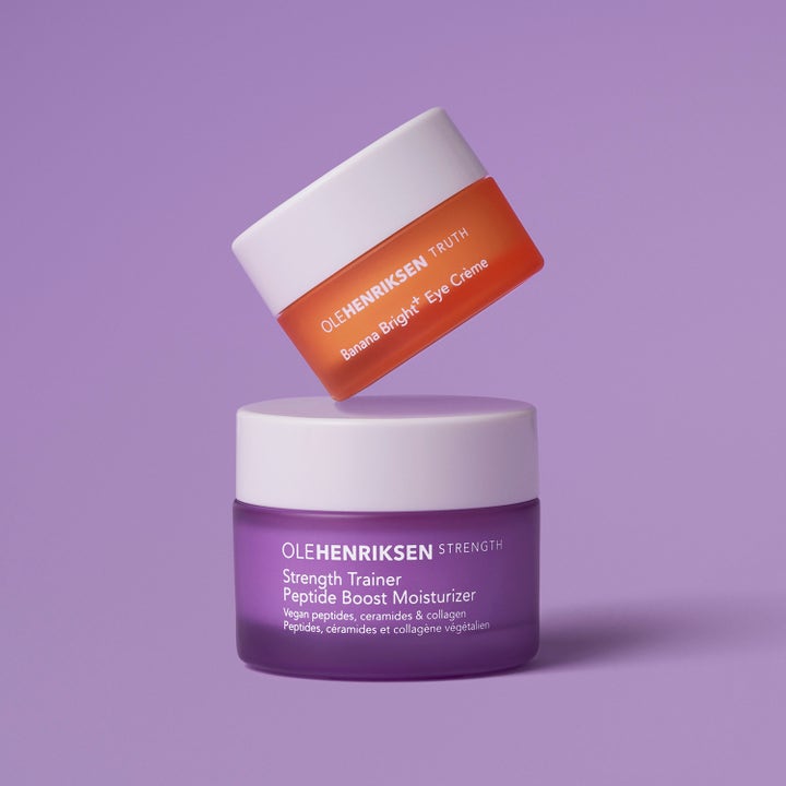 Ole Henriksen Strength Trainer og Banana Bright Eye Crème hudplejesæt med lilla og orange krukker