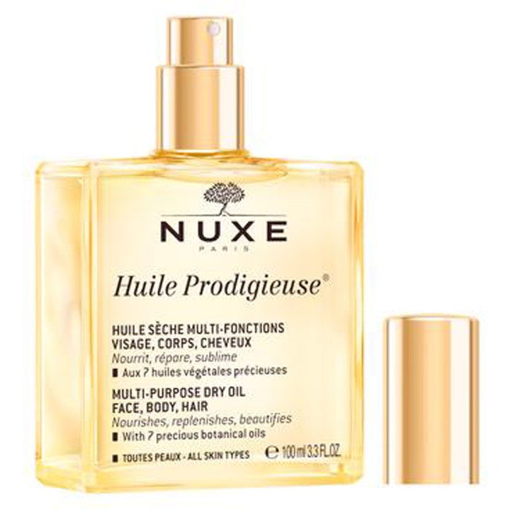 Nuxe Huile Prodigieuse 100 ml multifunktionel tørolie der plejer huden i en firkantet glasflaske med guldlåg.