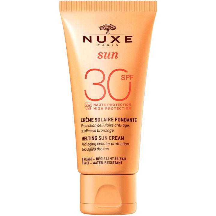 Nuxe Sun Melting Sun Cream SPF 30 beskyttende solcreme til ansigtet i en ferskenfarvet tube med vippelåg