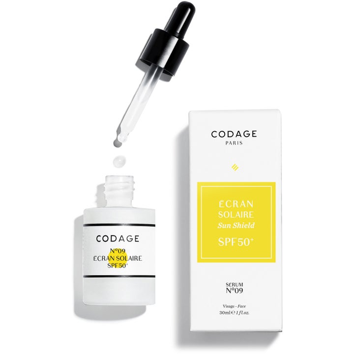 Codage N°09 Écran Solaire 30ml beskyttende solserum SPF 50 i hvid glasflaske med pipette der drypper ved æske