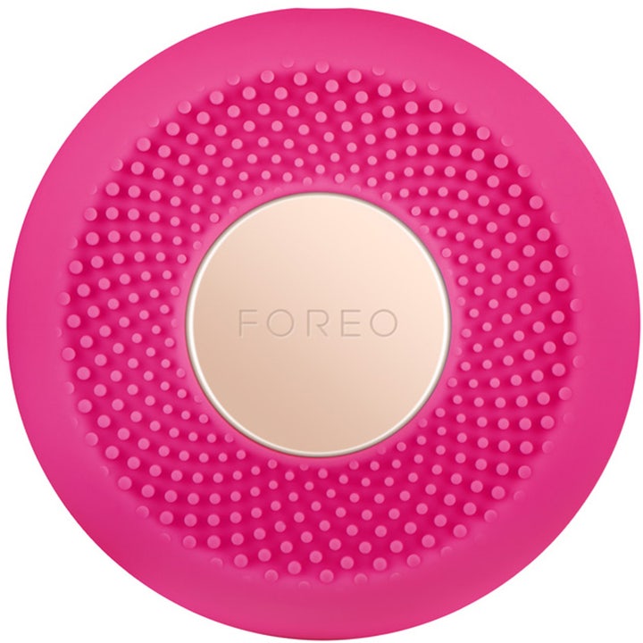 Foreo UFO Mini Fuchsia ansigtsapparat til hudpleje i pink silikone med guldplade og dupper.