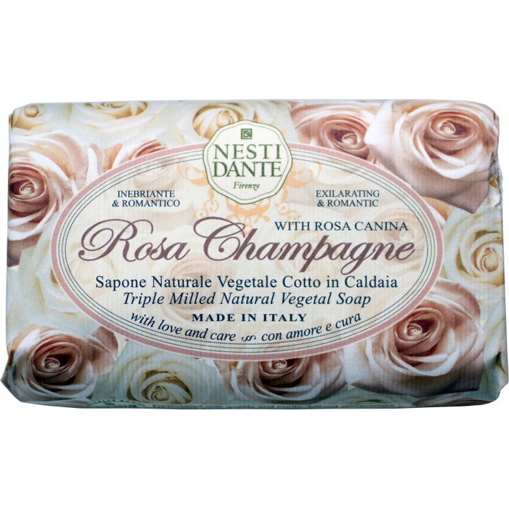 Nesti Dante Rosa Champagne 250 g vegetabilsk sæbe i papirindpakning dekoreret med lyse cremefarvede roser.