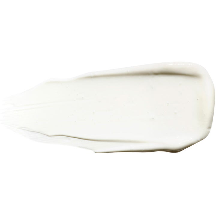 Exuviance Daily Corrector SPF35 40 g korrigerende ansigtssolcreme vist som en glat hvid creme tekstur