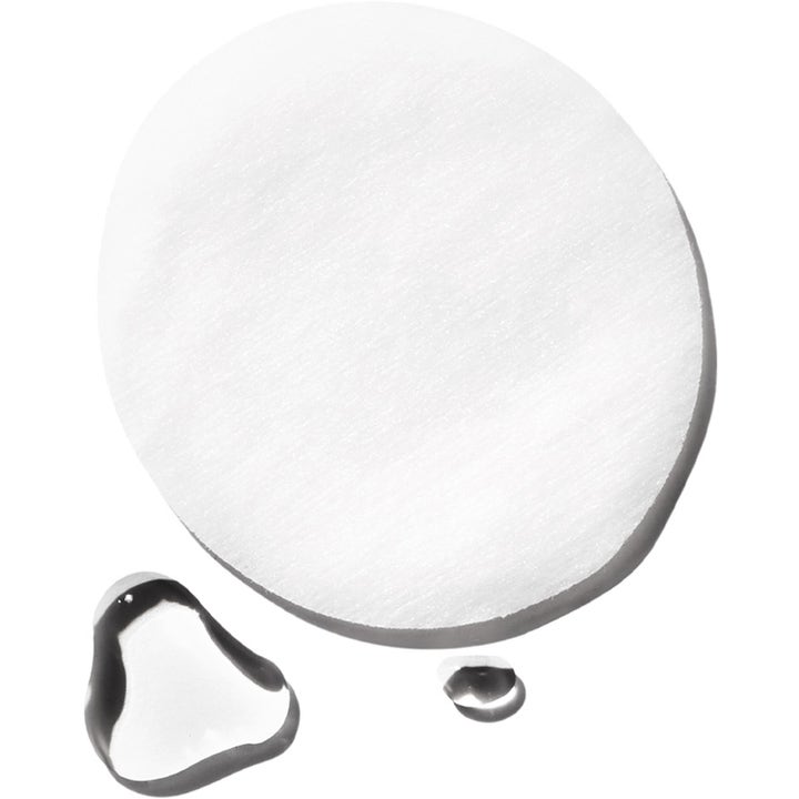 Exuviance Gentle Daily Exfoliating 60 Pads giver glød med en hvid rund rondel og klare dråber